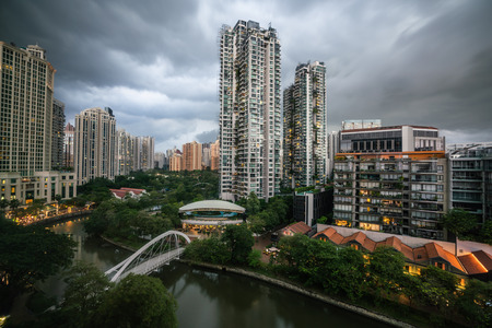 Singapore aerial river view and robertsan quay and bridge with overcast stormy weatherの写真素材