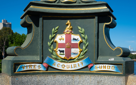 Melbourne city coat of arms and Latin motto Vires Acquirit Eundo on Princes bridge in Victoria Australia translation: We gather strength as we goの写真素材