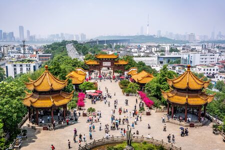 25 April 2018, Wuhan China : Scenic view of the Yangtze great bridge with people and crane statue from the Yellow Crane tower in Wuhan Hubei Chinaのeditorial素材