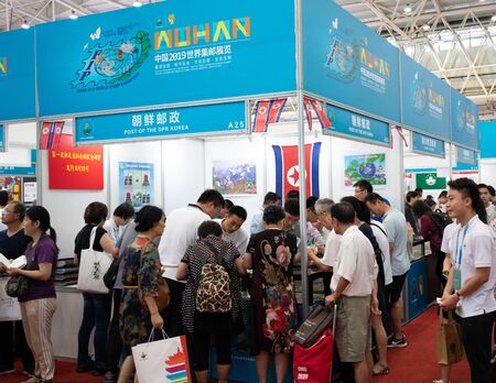 16 June 2019, Wuhan China : North Korea booth with people and alley at the China 2019 World stamp...