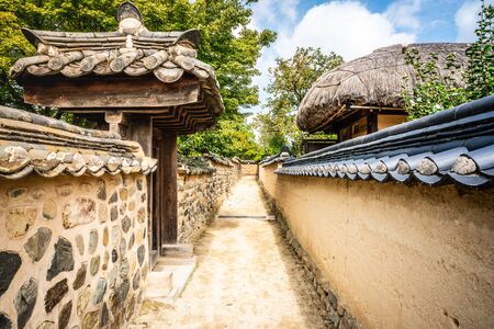 Alley with houses walls and gates in historic Hahoe folk village in Andong South Koreaの写真素材