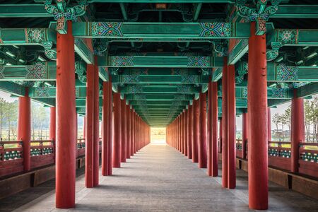 Woljeonggyo covered bridge with perfectly aligned red colonnade in Gyeongju South Koreaの写真素材