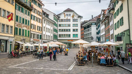Lucerne Switzerland, 28 June 2020: Restaurants terraces full of people and old colorful buildings on Muhlenplatz square in Lucerne old town Switzerlandのeditorial素材
