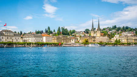 Lucerne Switzerland, June 28, 2020: Cityscape of Lucerne skyline taken from the lake with Wilhelm tell touristic boat and Church of St. Leodegar in Lucerne Switzerlandのeditorial素材