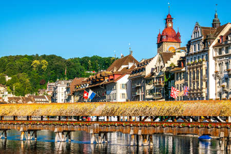 Lucerne old town skyline view with part of the covered Chapel bridge and colorful old buildings...