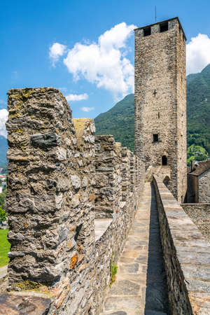 Scenic vertical view of Castelgrande castle tower taken from rampart walk and blue sky during summer in Bellinzona Ticino Switzerlandのeditorial素材