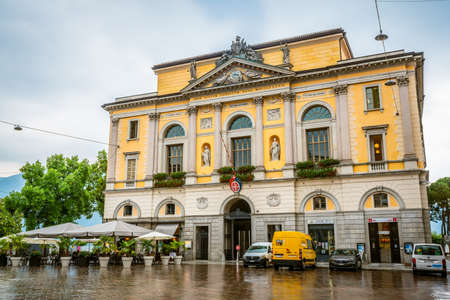 Lugano Switzerland, 1 July 2020: Front view of Lugano palazzo civico or city hall yellow building on overcast weather day in Lugano Ticino Switzerlandのeditorial素材