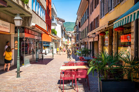 Aigle Switzerland, 4 July 2020: Pedestrian street view with restaurants and people on sunny summer day in Aigle Vaud Switzerlandのeditorial素材