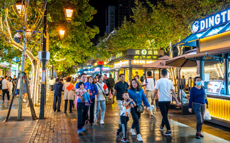 Kunming China, 3 October 2020: Food stalls and people in Nanping pedestrian street illuminated at night in Kunming Yunnan Chinaのeditorial素材