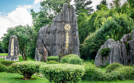 Kunming China, 4 October 2020: Limestone with Unesco world heritage sign in Shilin stone forest Yunnan Chinaのeditorial素材