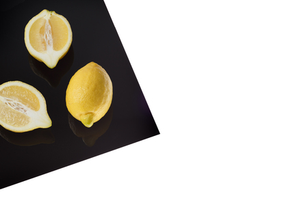 Lemon on Black Sheet Isolated on whiteの写真素材