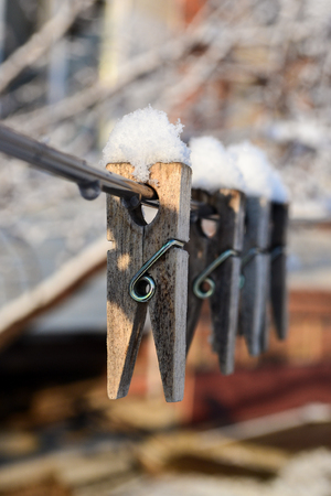 The snow cap on clothespinの写真素材
