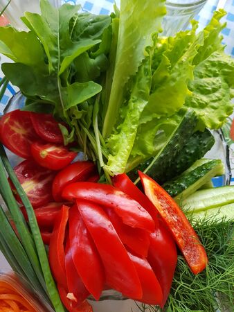 a plate of vegetables and herbsの写真素材