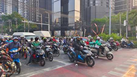 Motorcyclists on the street in Thailand.の写真素材