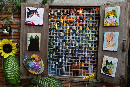 Colorful felt art on a wall in a small village in Indiaの写真素材