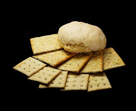 fresh bread and crackers on black backgroundの写真素材