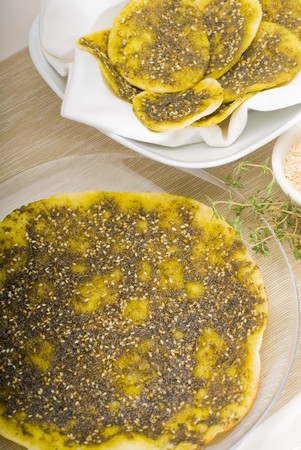 lebanese manouche or manoushe ,lebanese pizza with thyme and sesame seeds,zaatar, and extra virgin...