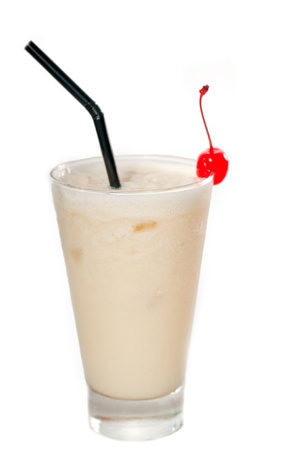 frozen banana daiquiri drink cocktail with red cherry and black straw isolated on white backgroundの写真素材