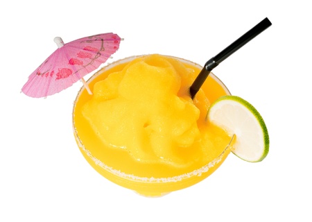 frozen mango margarita daiquiri with lime black straw and pink umbrella isolated on white backgroundの写真素材