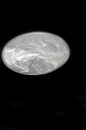 American silver eagle dollar coin over blackの写真素材