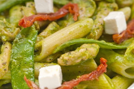 classic Italian penne pasta with sundried tomato and basilの写真素材