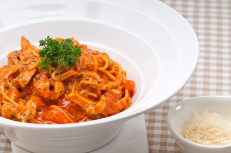 Italian spaghetti pasta with tomato and chicken sauceの写真素材