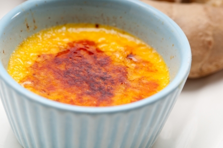 fresh ginger creme brulee dessert macro with raw ginger rootsの写真素材