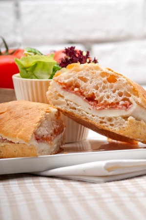 Italian ciabatta panini sandwich with parma ham and tomatoの写真素材