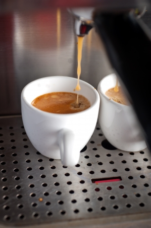Italian espresso coffe making with professional machine macro の写真素材