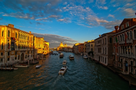 Venice Italy grand canal view from the top of Accademia bridge with "Madonna della Salute" church on background at sunsetの写真素材