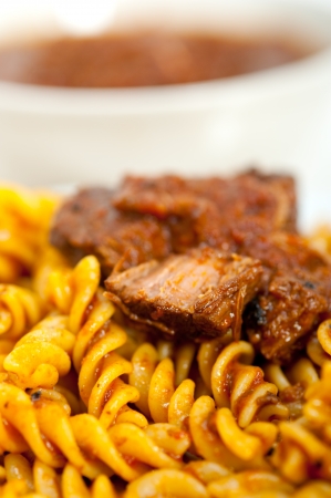 fusilli pasta al dente with neapolitan style ragu meat sauce very different from bolognese styleの写真素材