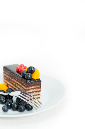 chocolate cake and fresh fruit on top closeup macroの写真素材