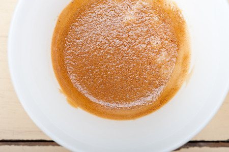 italian espresso cofee and beans on a white wood tableの写真素材