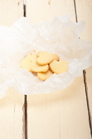 fresh baked heart shaped shortbread valentine day cookies on a paper wrapの写真素材