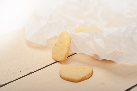 fresh baked heart shaped shortbread valentine day cookies on a paper wrapの写真素材