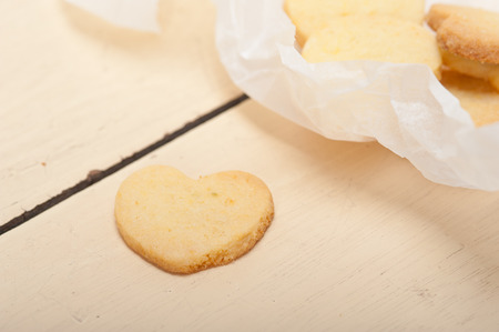 fresh baked heart shaped shortbread valentine day cookies on a paper wrapの写真素材
