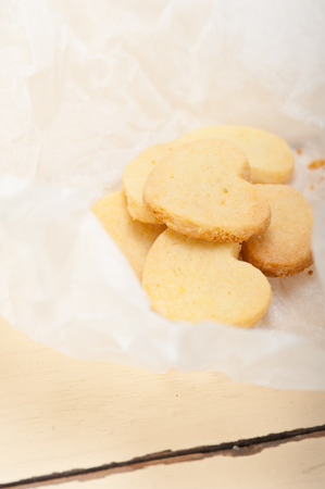 fresh baked heart shaped shortbread valentine day cookies on a paper wrapの写真素材