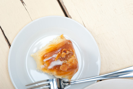 fresh home baked sweet bread donut cake with almonds and icing sugar on topの写真素材