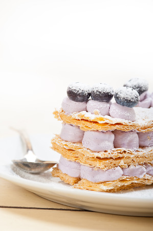 fresh baked napoleon blueberry and cream cake dessertの写真素材