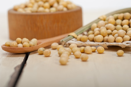 organic soya beans over rustic wood table macro closeupの写真素材