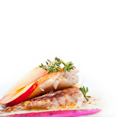 sea bream orata  fillet butter pan fried with fresh peach prune and dragonfruit slices thyme on top