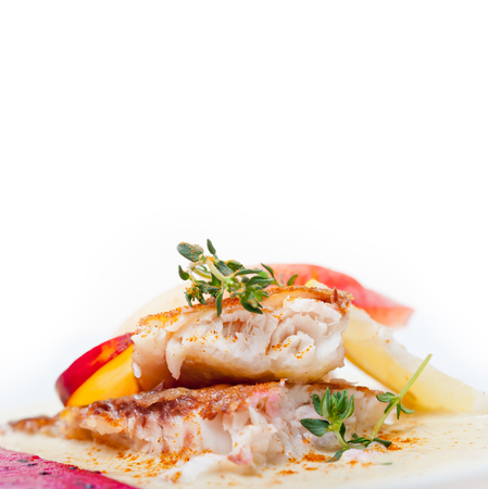 sea bream orata  fillet butter pan fried with fresh peach prune and dragonfruit slices thyme on top