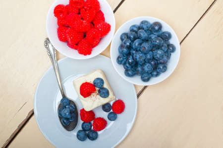 fresh homemade raspberry and blueberry cream cakeの写真素材
