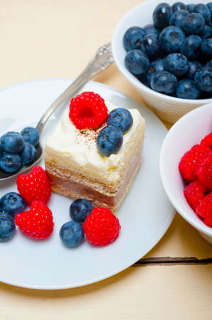fresh homemade raspberry and blueberry cream cakeの写真素材