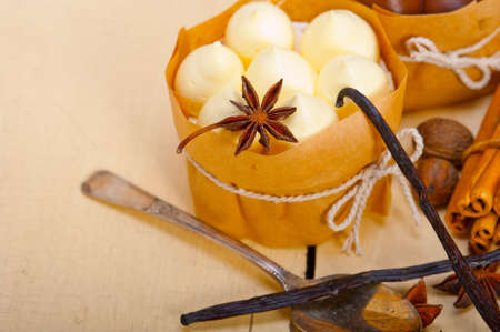 fresh baked chocolate vanilla and spices cream cake dessert over rustic wood table
