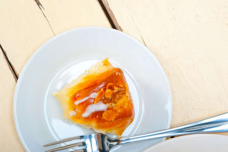 fresh home baked sweet bread donut cake with almonds and icing sugar on topの写真素材