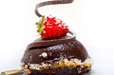 fresh chocolate strawberry mousse over white with silver spoon