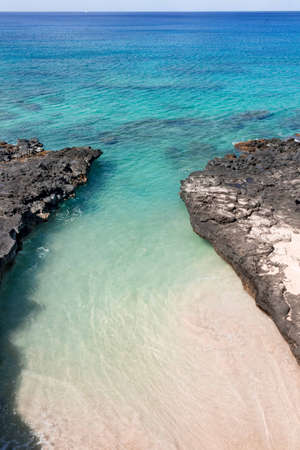 Tide pool on the west side of the island of Oahu in Hawaii.  This image displays pristine blue...