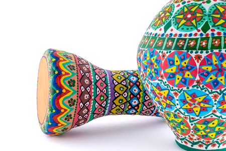 Two pieces of colorful painted potteries, an Egyptian drinking jar (arabic: Kolla) and a goblet drum (also chalice drum, tarabuka, darbuka, debuka)の写真素材