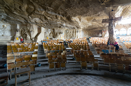St. Samaan the Tanner Hall with walls decorated with artworks engraved on the rocks representing scenarios from the Bible and a big cross, Part of a huge cave discovered in 1974 in Saint Samaan The Tanner Monastery, and prepared later to contain the hall のeditorial素材